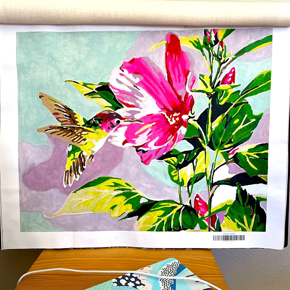 Colorful hummingbird among tropical foliage
